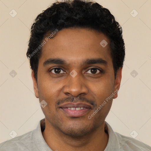 Joyful black young-adult male with short  black hair and brown eyes