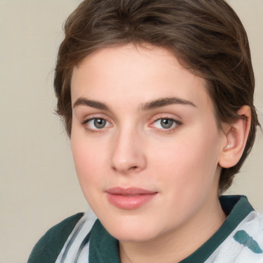 Joyful white young-adult female with medium  brown hair and green eyes