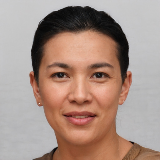 Joyful white young-adult female with short  black hair and brown eyes