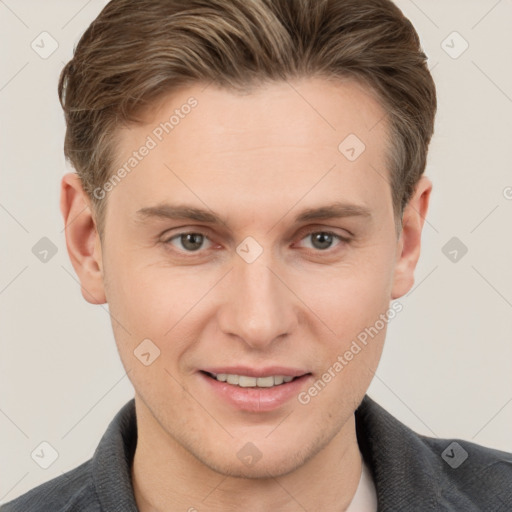 Joyful white adult male with short  brown hair and grey eyes