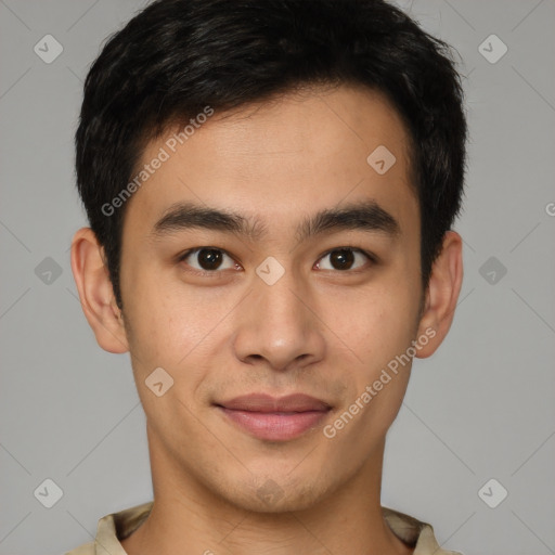 Joyful latino young-adult male with short  brown hair and brown eyes