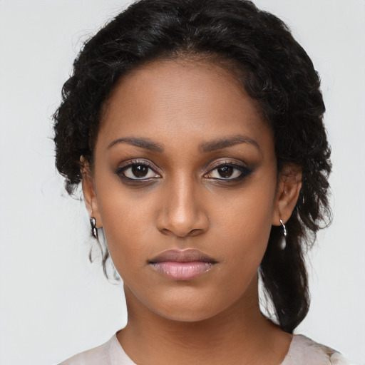 Neutral black young-adult female with long  brown hair and brown eyes