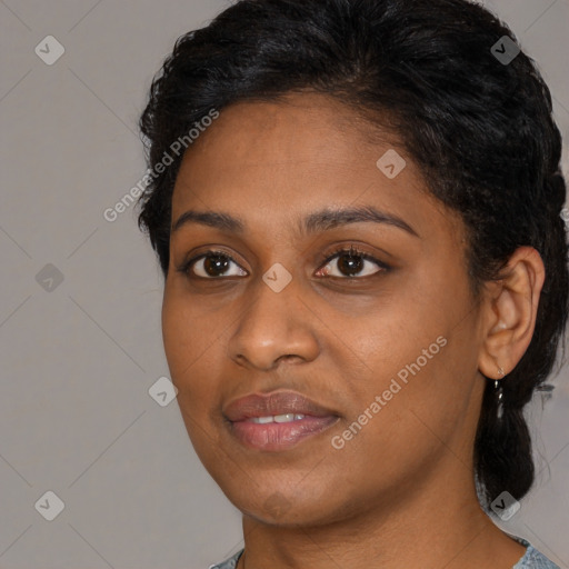 Joyful black young-adult female with medium  black hair and brown eyes