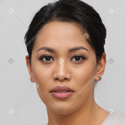 Joyful asian young-adult female with short  brown hair and brown eyes