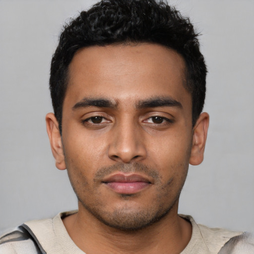 Neutral latino young-adult male with short  black hair and brown eyes