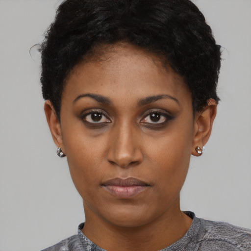 Neutral latino young-adult female with short  black hair and brown eyes