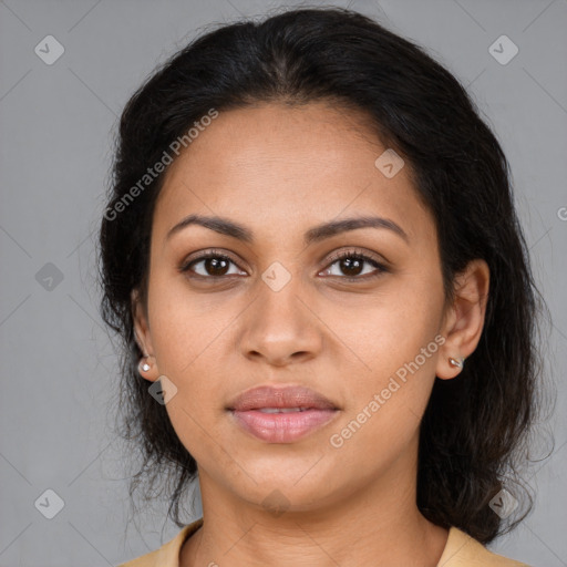 Joyful latino young-adult female with medium  brown hair and brown eyes