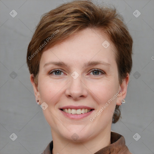 Joyful white young-adult female with short  brown hair and grey eyes