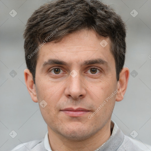 Joyful white adult male with short  brown hair and brown eyes