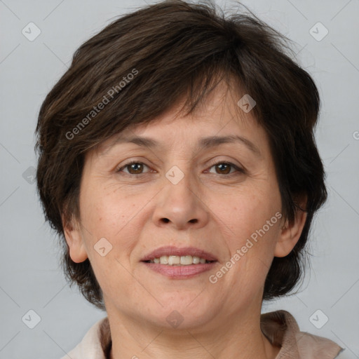 Joyful white adult female with medium  brown hair and brown eyes