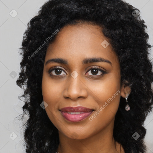 Joyful black young-adult female with long  black hair and brown eyes