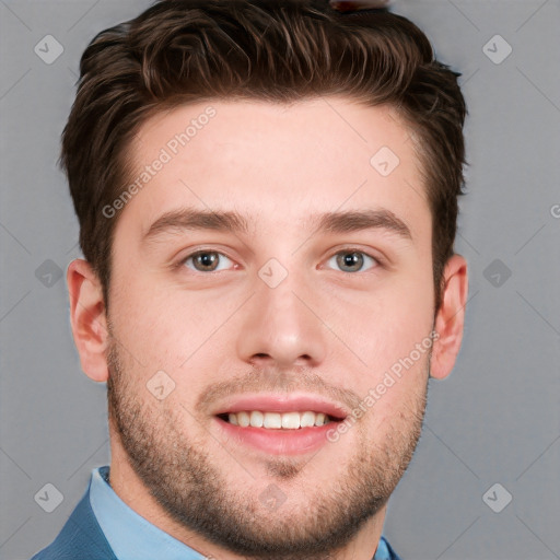 Joyful white young-adult male with short  brown hair and grey eyes