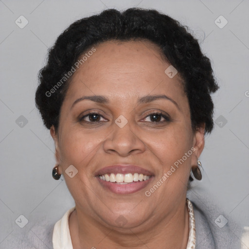 Joyful black adult female with short  brown hair and brown eyes