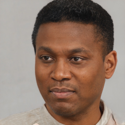 Neutral black young-adult male with short  black hair and brown eyes
