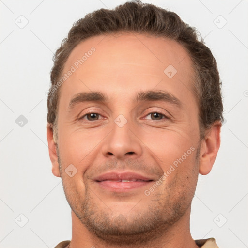 Joyful white adult male with short  brown hair and brown eyes