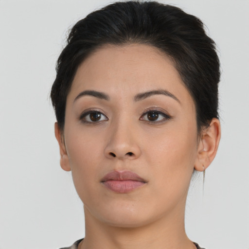 Neutral asian young-adult female with short  brown hair and brown eyes