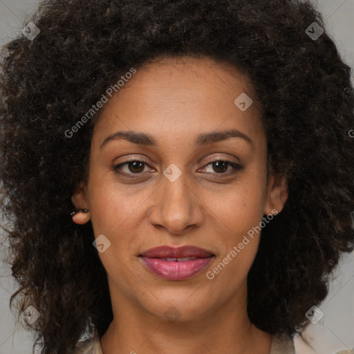 Joyful black adult female with medium  brown hair and brown eyes