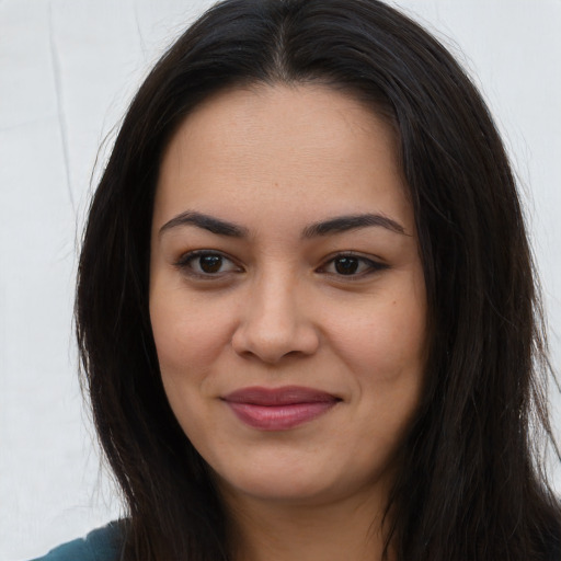 Joyful asian young-adult female with long  brown hair and brown eyes