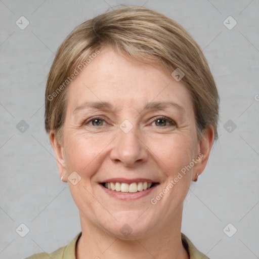 Joyful white adult female with short  brown hair and grey eyes