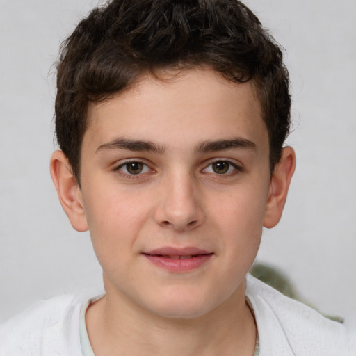 Joyful white child male with short  brown hair and brown eyes