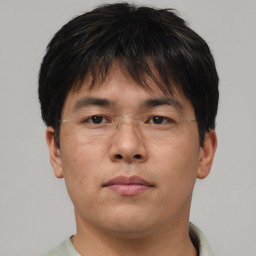 Neutral asian young-adult male with short  brown hair and brown eyes