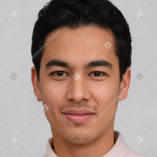 Joyful latino young-adult male with short  black hair and brown eyes