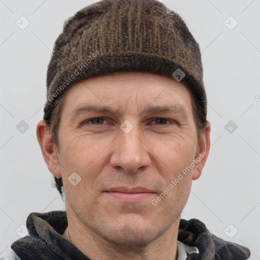 Joyful white adult male with short  brown hair and grey eyes