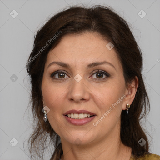 Joyful white adult female with long  brown hair and brown eyes