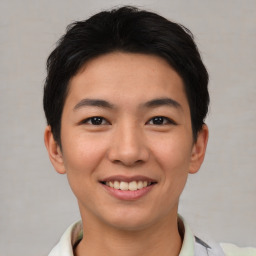 Joyful asian young-adult male with short  black hair and brown eyes