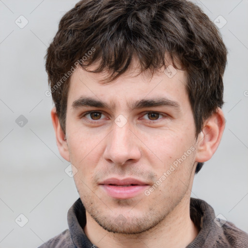 Neutral white young-adult male with short  brown hair and grey eyes