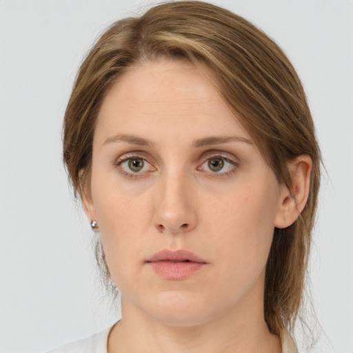 Neutral white young-adult female with medium  brown hair and green eyes