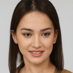 Joyful asian young-adult female with long  brown hair and brown eyes