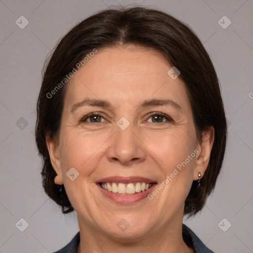 Joyful white adult female with medium  brown hair and brown eyes