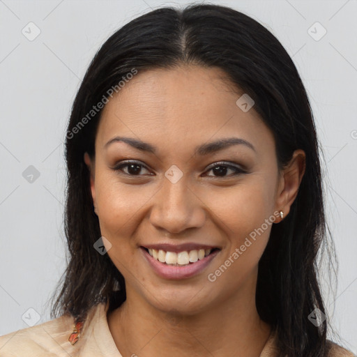 Joyful latino young-adult female with long  brown hair and brown eyes