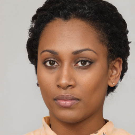 Neutral black young-adult female with short  black hair and brown eyes
