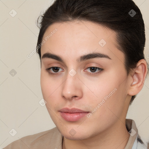 Neutral white young-adult female with long  brown hair and brown eyes