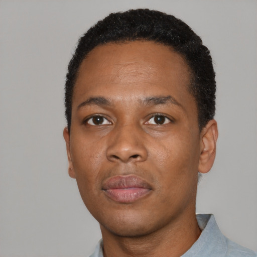 Neutral black adult male with short  black hair and brown eyes