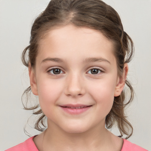 Joyful white child female with medium  brown hair and grey eyes