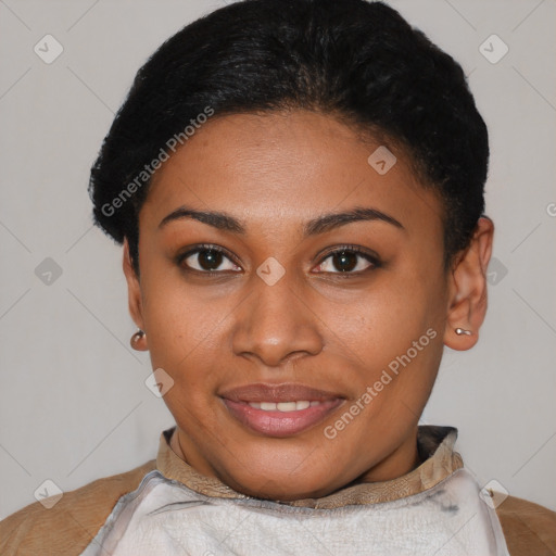 Joyful black young-adult female with short  black hair and brown eyes