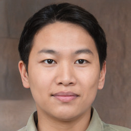 Joyful asian young-adult male with short  brown hair and brown eyes