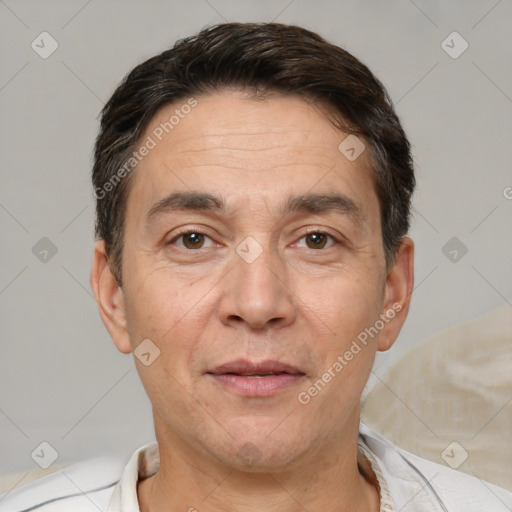 Joyful white adult male with short  brown hair and brown eyes