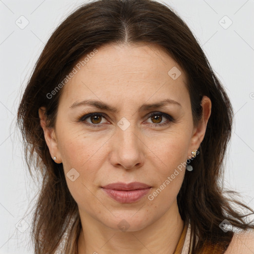 Joyful white adult female with long  brown hair and brown eyes