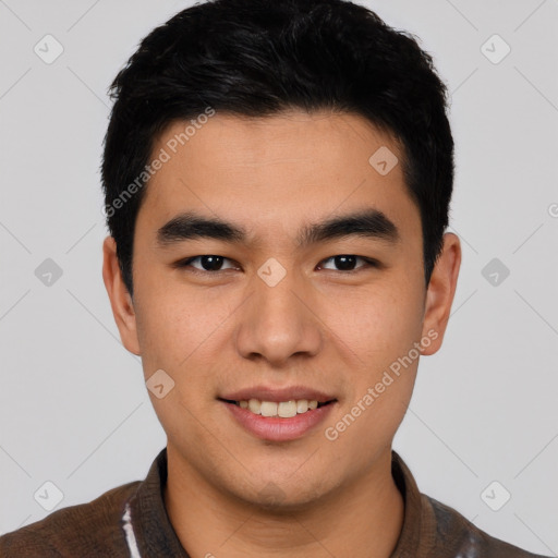 Joyful asian young-adult male with short  black hair and brown eyes