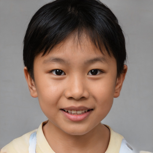 Joyful white child female with short  brown hair and brown eyes