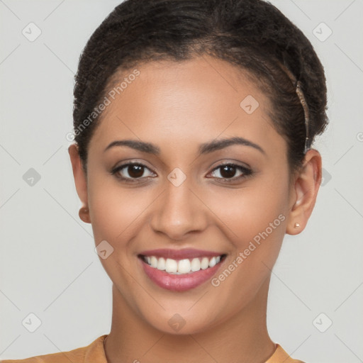 Joyful latino young-adult female with short  brown hair and brown eyes