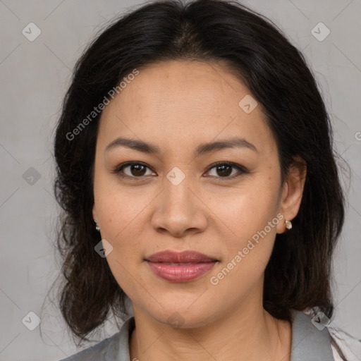 Joyful latino young-adult female with medium  brown hair and brown eyes