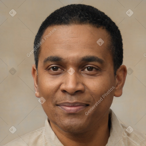 Joyful latino adult male with short  black hair and brown eyes