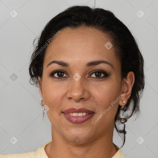 Joyful latino adult female with medium  brown hair and brown eyes