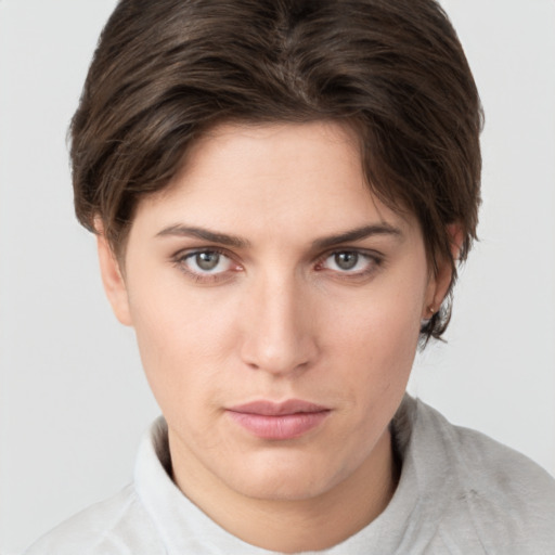 Neutral white young-adult female with short  brown hair and brown eyes