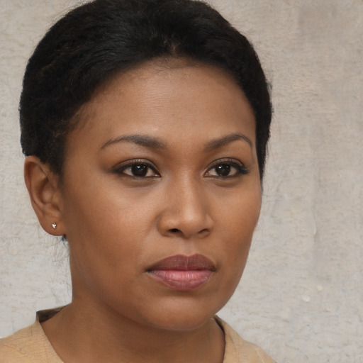 Neutral black young-adult female with short  brown hair and brown eyes